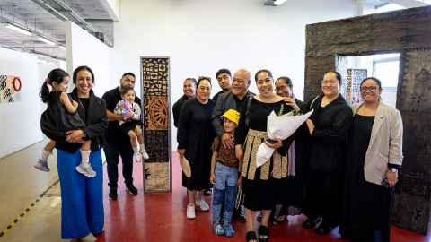 Artist Kato'one Koloamatangi stands with family and supporters in front of her installation 'To Pa' at the Elam Artists Graduate Show 2023.